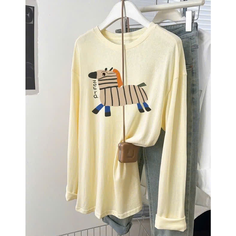 Áo thun nữ tay dài chất thun xượt giấy in hình JULY fashion2023, Áo dài tay nữ form rộng mặc mát trẻ trung