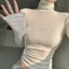 Áo thun dài tay cổ lọ màu trắng chất co giãn ôm body họa tiết hình trái tim đính đá dành cho nữ ATDT013- Tiktik