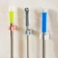 Combo 10 cái Móc dán tường kẹp giữ cây lau nhà, móc treo chổi chịu lực 6kg