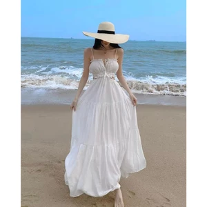 Váy đi biển dài trắng bo chun thắt nơ sau xoè ống hở lưng cho nữ
