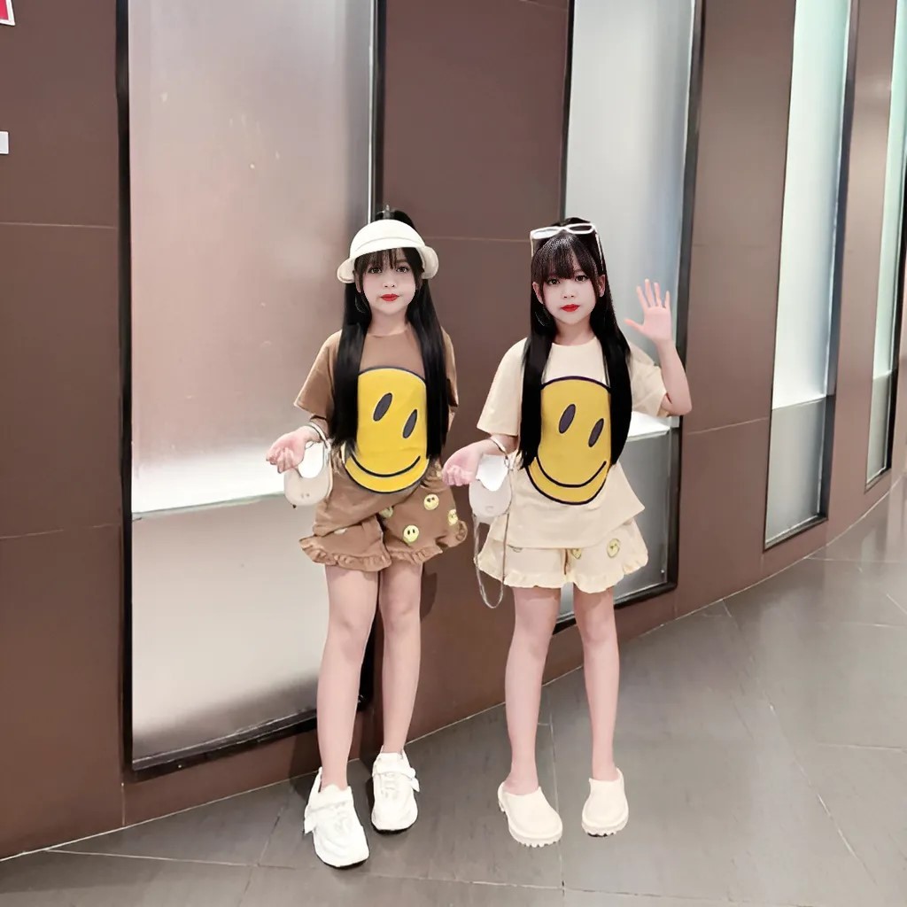 4-14 TUỔI Bộ quần áo bé gái áo cộc tay in hình mặt cười dễ thương chất vải cotton mềm mịn.M19