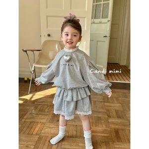 CANDIMIMI Set áo dài tay và chân váy đính hình trái tim - Phong cách Hàn Quốc