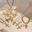 Phong cách Mỹ Hiphop Golden Cross Vòng cổ Chữ Thập xếp chồng lên nhau QUEMEO mạ vàng 18k không gỉ Vòng cổ dài