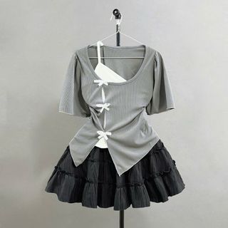 Set bộ Bigsize Nữ áo thun kiểu tay ngắn cách điệu 2 lớp viền gắn nơ phối chân váy chữ A bèo có quần bảo hộ - SET978