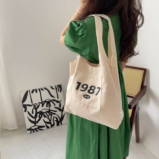 Túi tote túi vải canvas liền thân đeo vai thời trang có ngăn ngoài hoạ tiết basic đựng vừa a4 - tuic2000