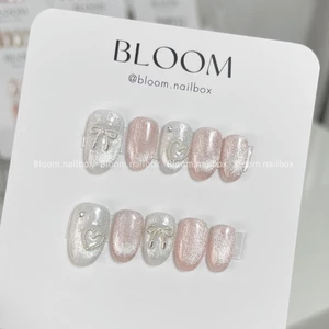 Nailbox thiết kế mắt mèo hồng đính nơ bạc xinh xắn by Bloom.nailbox