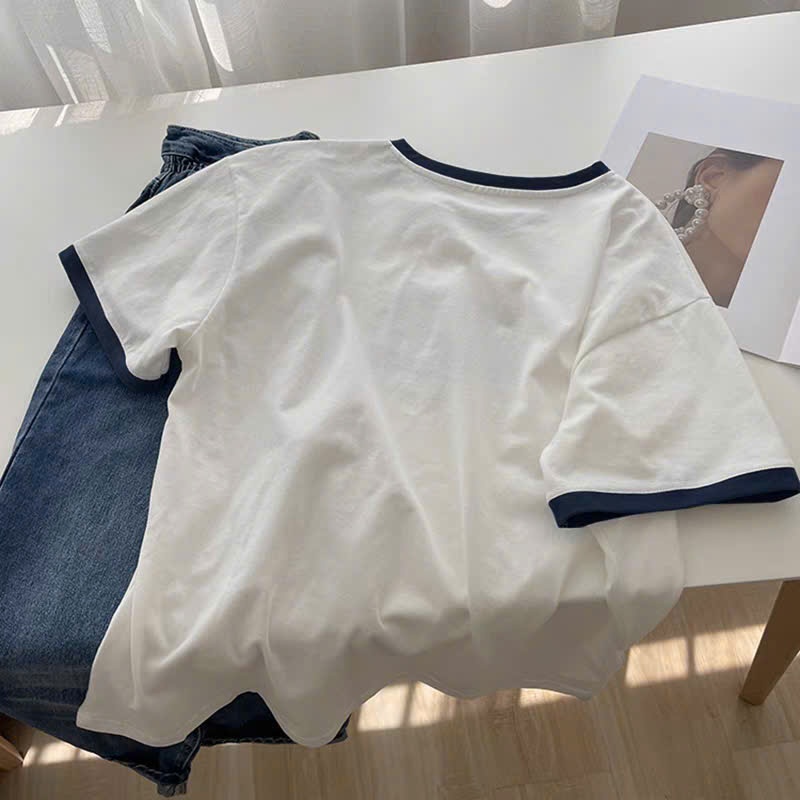 Áo thun nữ ngắn tay SLEEK STUDIO, chất cotton mềm mại, in họa tiết độc đáo, cổ tròn và dáng rộng thời trang. | BigBuy360 - bigbuy360.vn