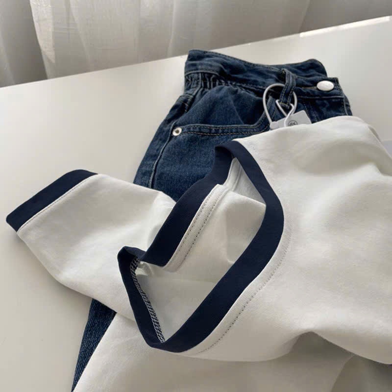 Áo thun nữ ngắn tay SLEEK STUDIO, chất cotton mềm mại, in họa tiết độc đáo, cổ tròn và dáng rộng thời trang. | BigBuy360 - bigbuy360.vn
