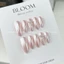 Nailbox thiết kế tráng gương nền hồng pastel thanh lịch nơ bạc xinh Bloom.nailbox