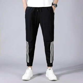Quần thể dục 3 sọc dáng dài ống suông và bo gấu kiểu jogger có khóa kéo túi trẻ trung mới - DTB K1