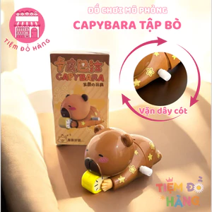 Đồ Chơi Capybara Vặn Cót Ôm Đồng Hồ Ngủ Nướng Tự Động Di Chuyển