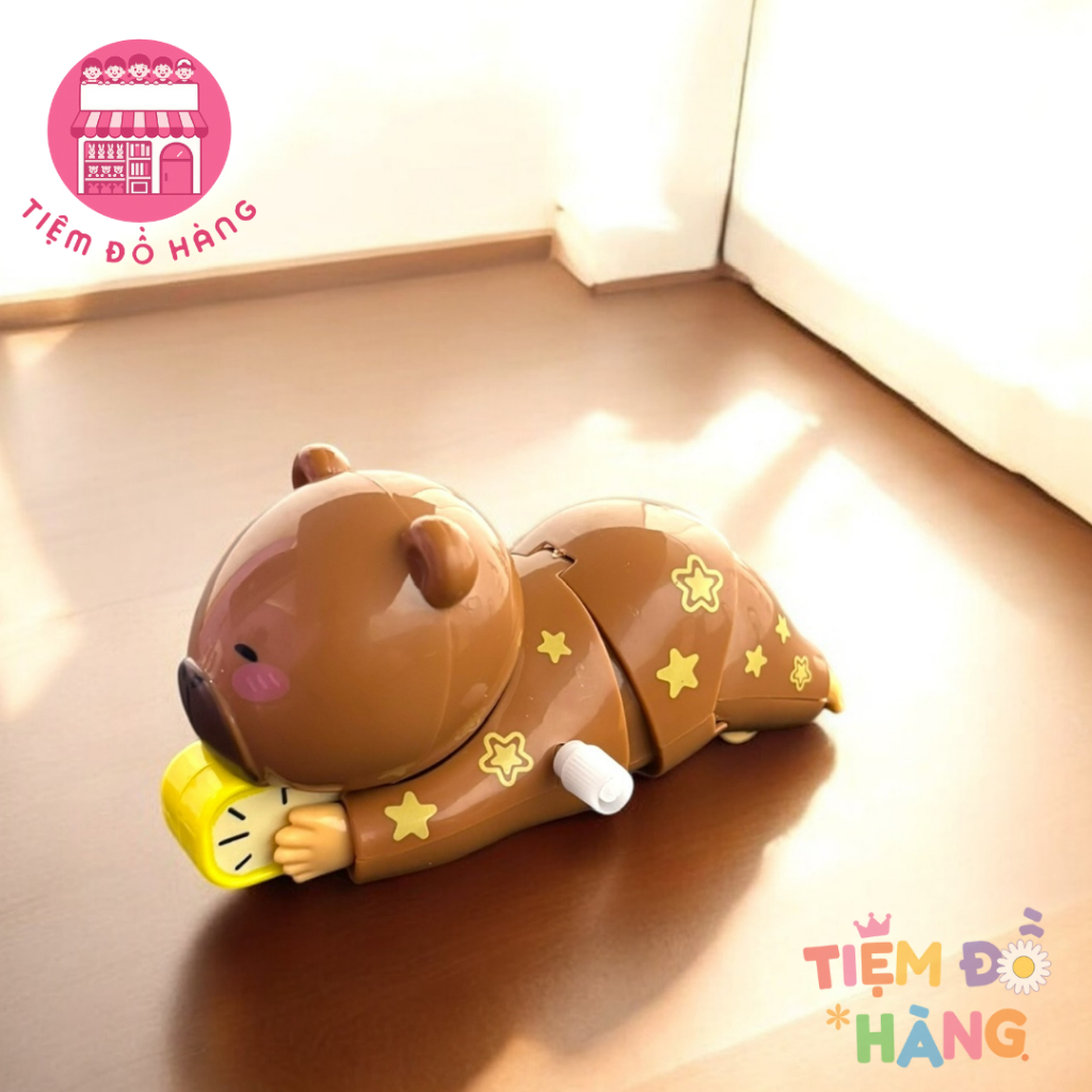 Đồ Chơi Capybara Vặn Cót Ôm Đồng Hồ Ngủ Nướng Tự Động Di Chuyển