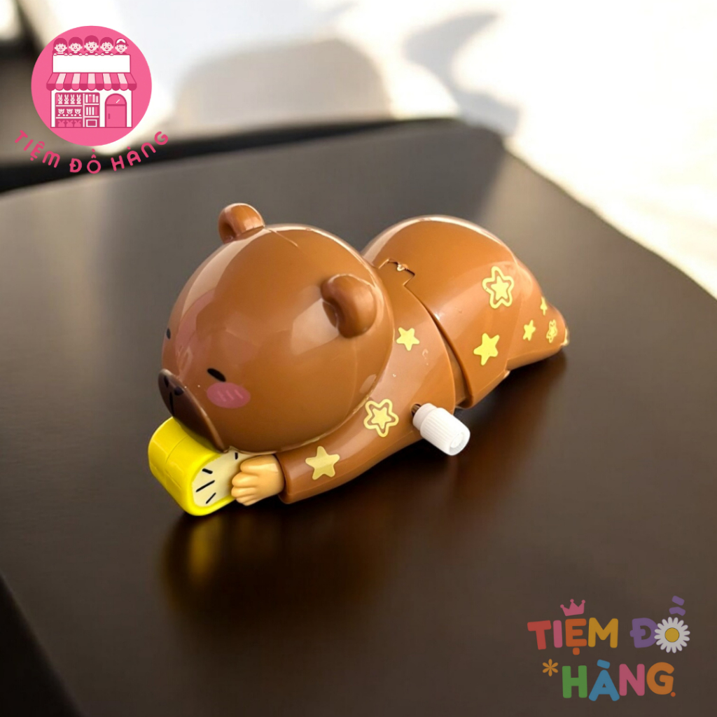 Đồ Chơi Capybara Vặn Cót Ôm Đồng Hồ Ngủ Nướng Tự Động Di Chuyển