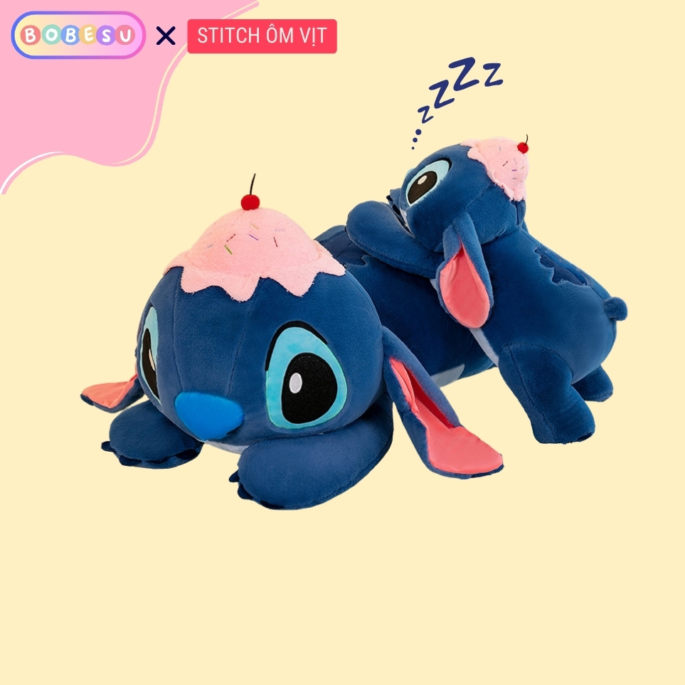 Gấu Bông Stitch Hồng Sakura Dùng Để Ôm Gác Chân Dựa Lưng Gấu Nằm Stick Đội Mũ Bánh Chất Liệu An Toàn Thân Thiện
