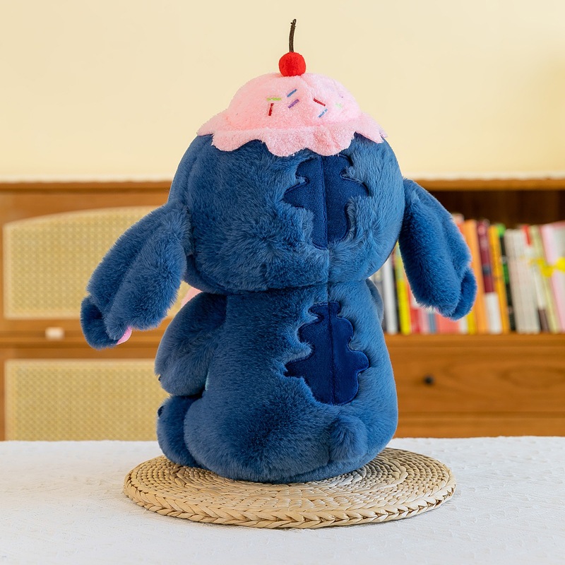 Gấu Bông Stitch Hồng Sakura Dùng Để Ôm Gác Chân Dựa Lưng Gấu Nằm Stick Đội Mũ Bánh Chất Liệu An Toàn Thân Thiện