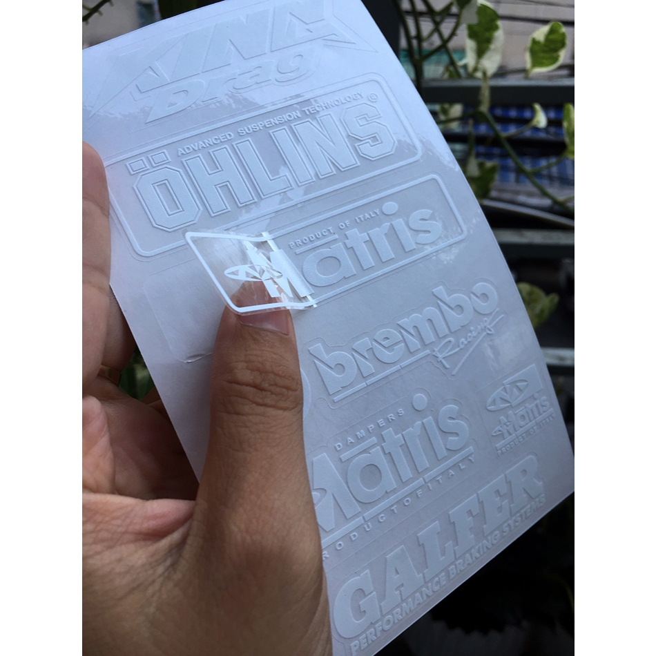 Tờ KINGDRA-OLINS chữ trắng in UV nền trong suốt. Decal chống nước. Logo Sticker cao cấp
