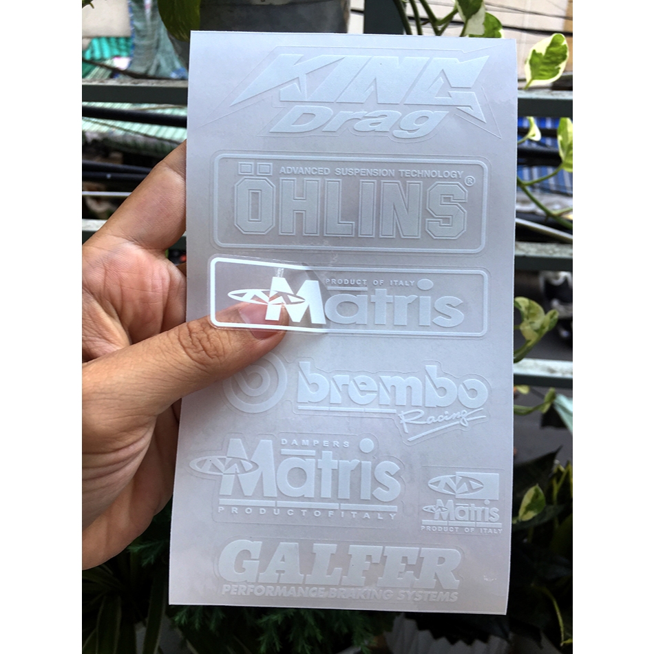 Tờ KINGDRA-OLINS chữ trắng in UV nền trong suốt. Decal chống nước. Logo Sticker cao cấp