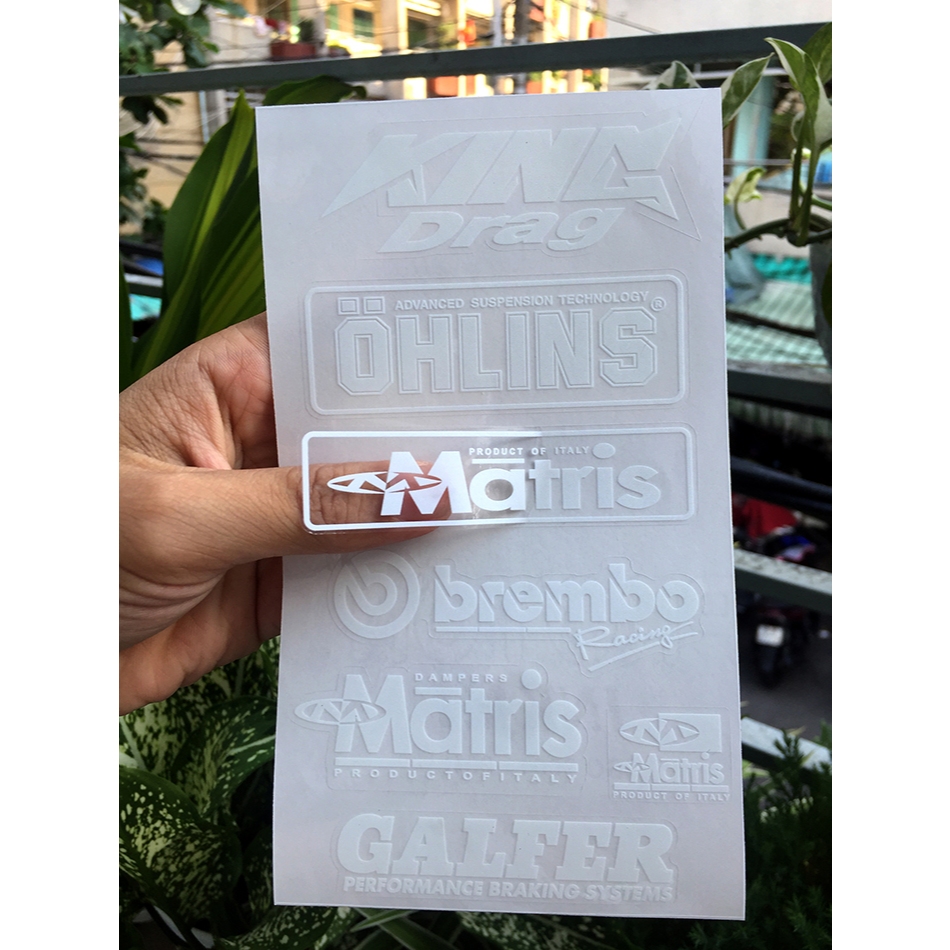 Tờ KINGDRA-OLINS chữ trắng in UV nền trong suốt. Decal chống nước. Logo Sticker cao cấp