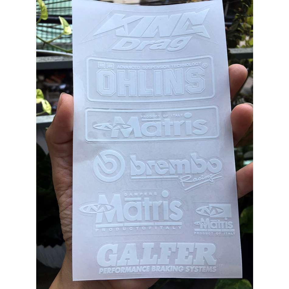 Tờ KINGDRA-OLINS chữ trắng in UV nền trong suốt. Decal chống nước. Logo Sticker cao cấp