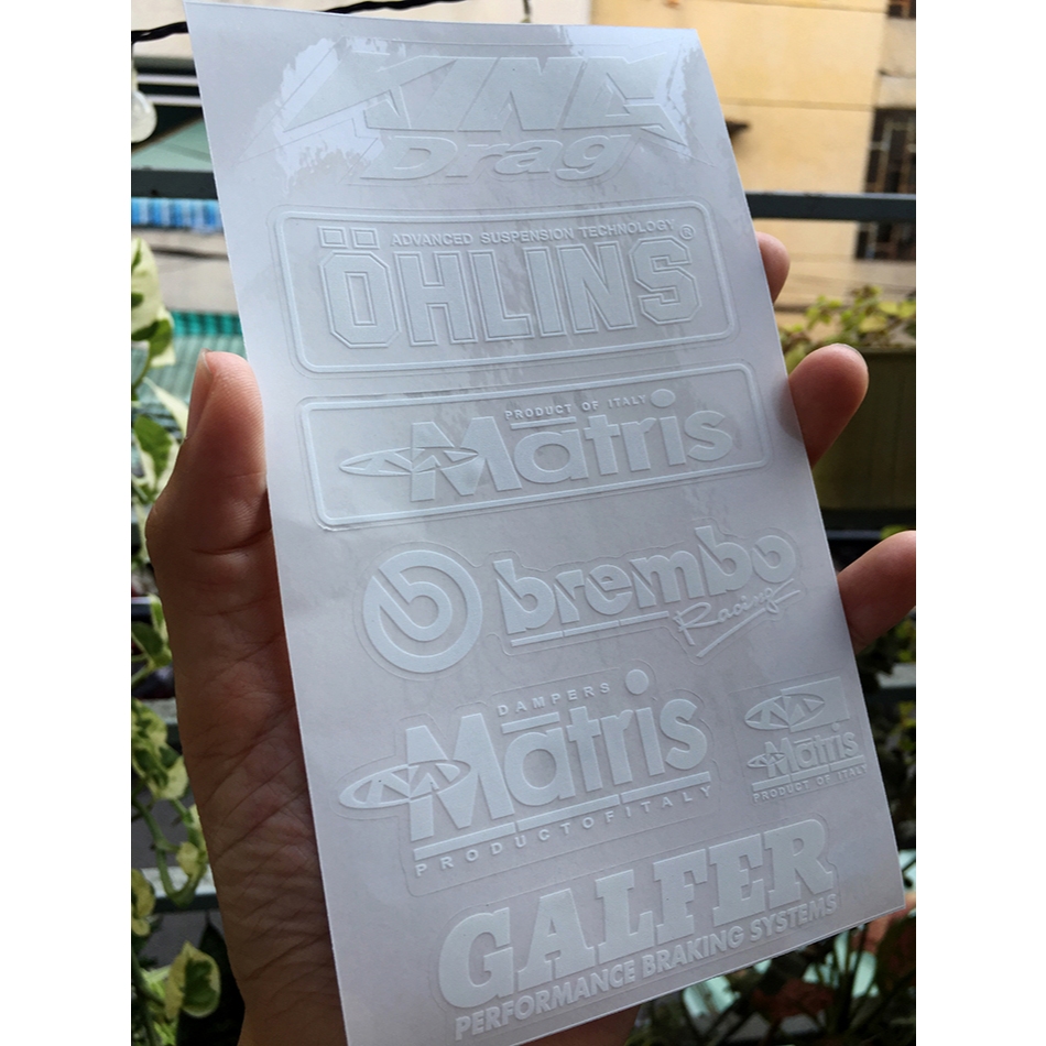 Tờ KINGDRA-OLINS chữ trắng in UV nền trong suốt. Decal chống nước. Logo Sticker cao cấp