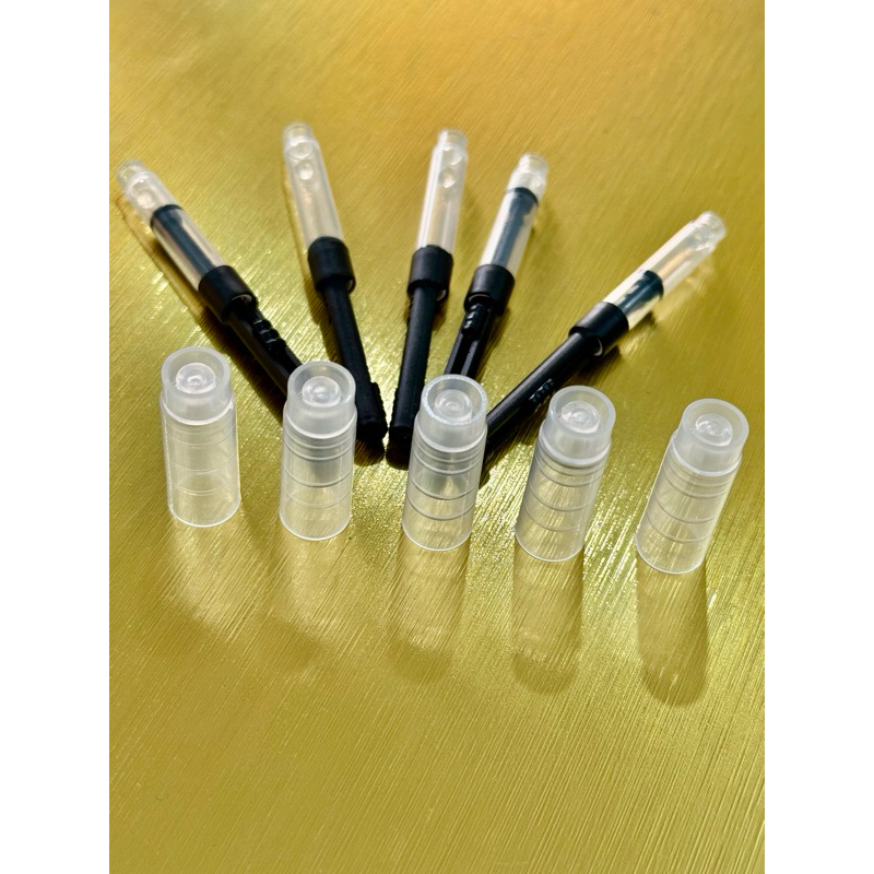 Pistong bơm mực và Nắp bút mực bấm