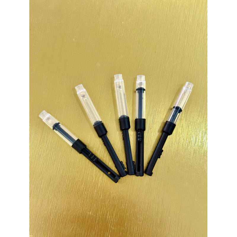 Pistong bơm mực và Nắp bút mực bấm
