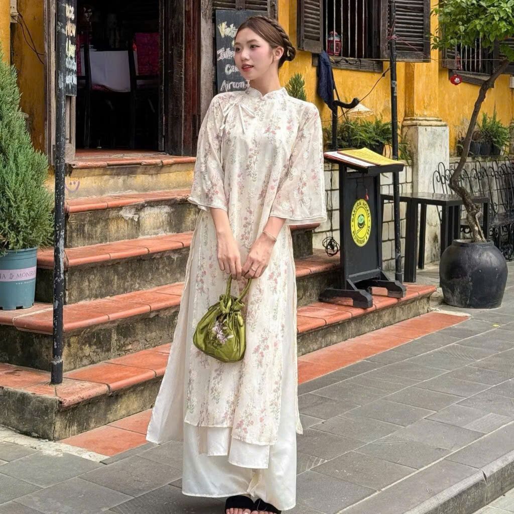 Áo dài voan tơ Bạch Vũ In hoa Tamdesigner phối thắt nơ đôi kèm quần satin bóng, Áo dài cách tân đẹp nhất 2026 T21