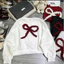 Áo Sweater Gắn Nơ Nổi Form Boxy Nữ - Áo Nỉ Thu Đông Phong Cách Hàn Quốc