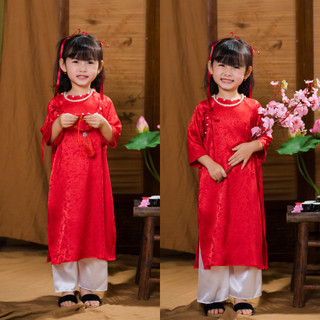 Áo dài tết cách tân cho bé gái phối nơ đi chơi lễ hội vải gấm lụa in nổi cho bé đính ngọc Tết 2026 DA01 - BIATONKIDS