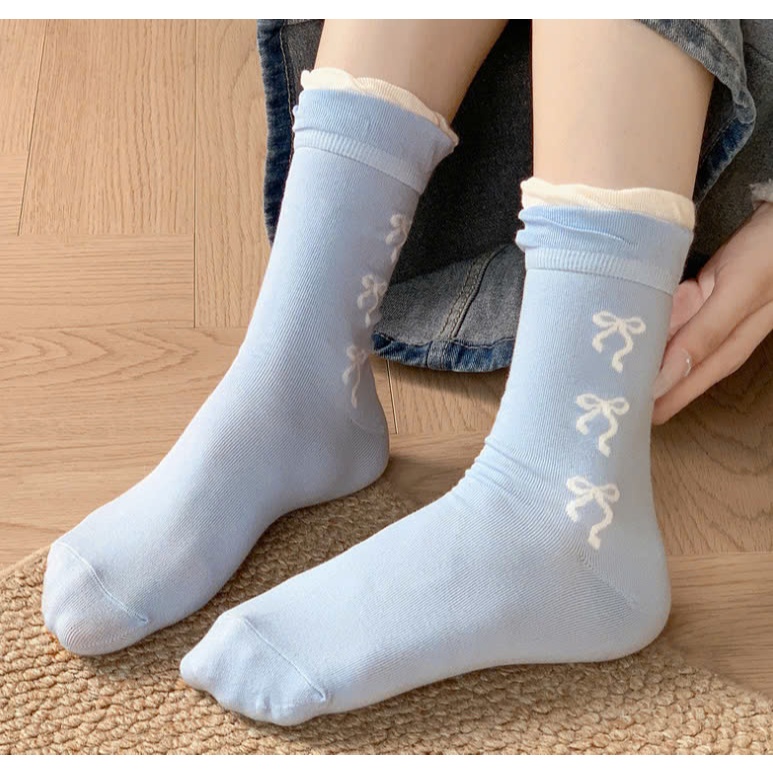 Vớ Tất nữ họa tiết nơ màu xanh, xám cổ cao phong cách trẻ trung, năng động.