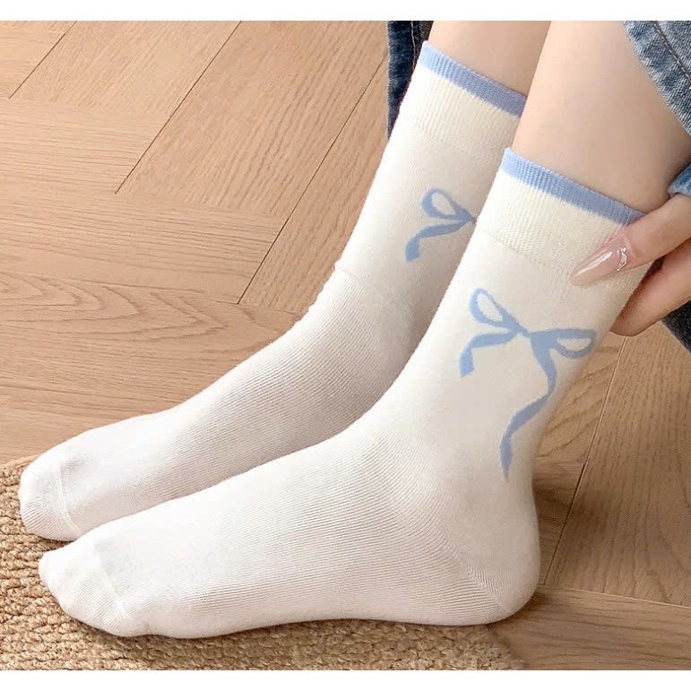 Vớ Tất nữ họa tiết nơ màu xanh, xám cổ cao phong cách trẻ trung, năng động.