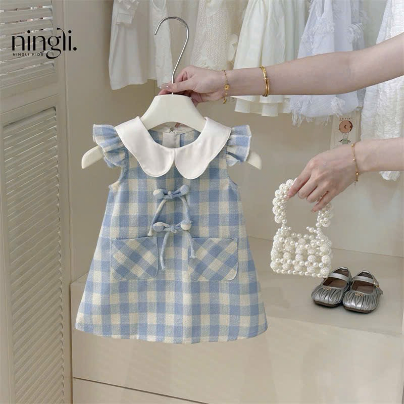 (Sẵn 90) Váy cổ bèo kẻ caro tay xoè đính khuy nơ phong cách Hàn Quốc dành cho bé gái