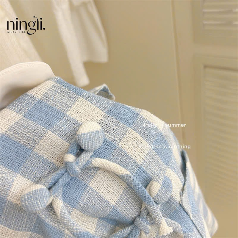 (Sẵn 90) Váy cổ bèo kẻ caro tay xoè đính khuy nơ phong cách Hàn Quốc dành cho bé gái
