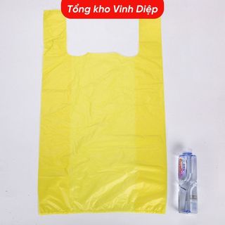 1kg túi nilon trong màu vàng có quai, chất dai đẹp đựng 15kg