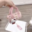 Túi xách nữ mini dáng trống da PU họa tiết Hello Kitty tặng kèm dây đeo chéo và charm bông gấu xinh yêu - ST993
