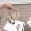 Túi xách nữ mini dáng trống da PU họa tiết Hello Kitty tặng kèm dây đeo chéo và charm bông gấu xinh yêu - ST993
