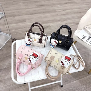 Túi xách nữ mini dáng trống da PU họa tiết Hello Kitty tặng kèm dây đeo chéo và charm bông gấu xinh yêu - ST993
