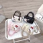 Túi xách nữ mini dáng trống da PU họa tiết Hello Kitty tặng kèm dây đeo chéo và charm bông gấu xinh yêu - ST993