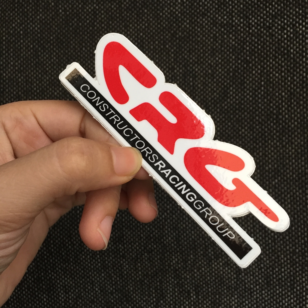 Logo CRG[10.7x3.3cm] nền trắng chữ đỏ. Hình dán decal siêu dính, chống nước, tem đua trang trí