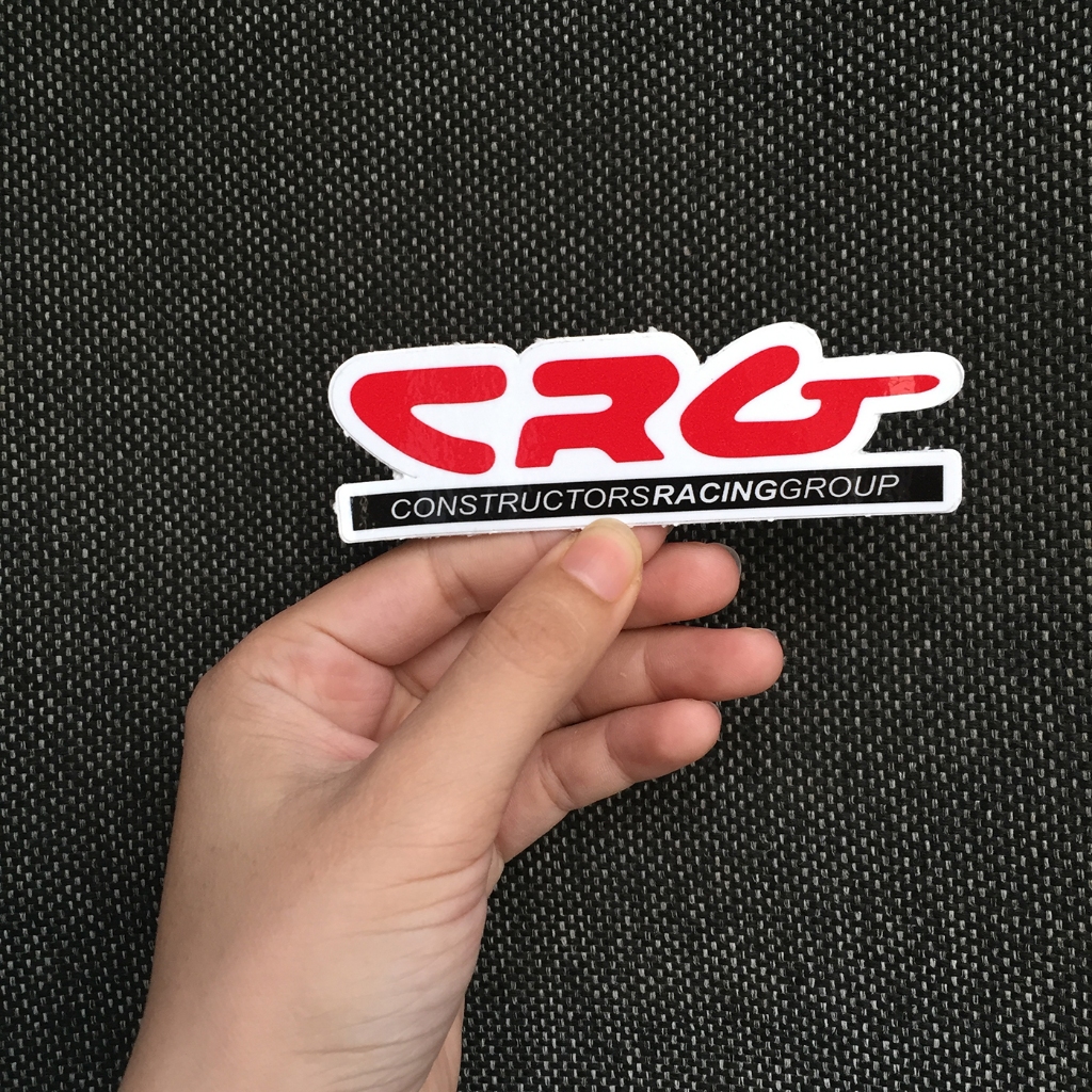 Logo CRG[10.7x3.3cm] nền trắng chữ đỏ. Hình dán decal siêu dính, chống nước, tem đua trang trí