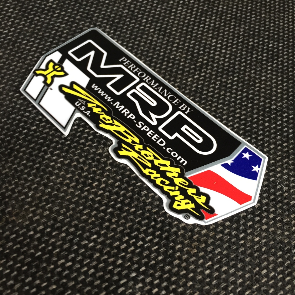 Logo TBs racing. Kích thước 10.4 x 5.8cm. Hình dán decal siêu dính. Chống nước, tem đua trang trí.