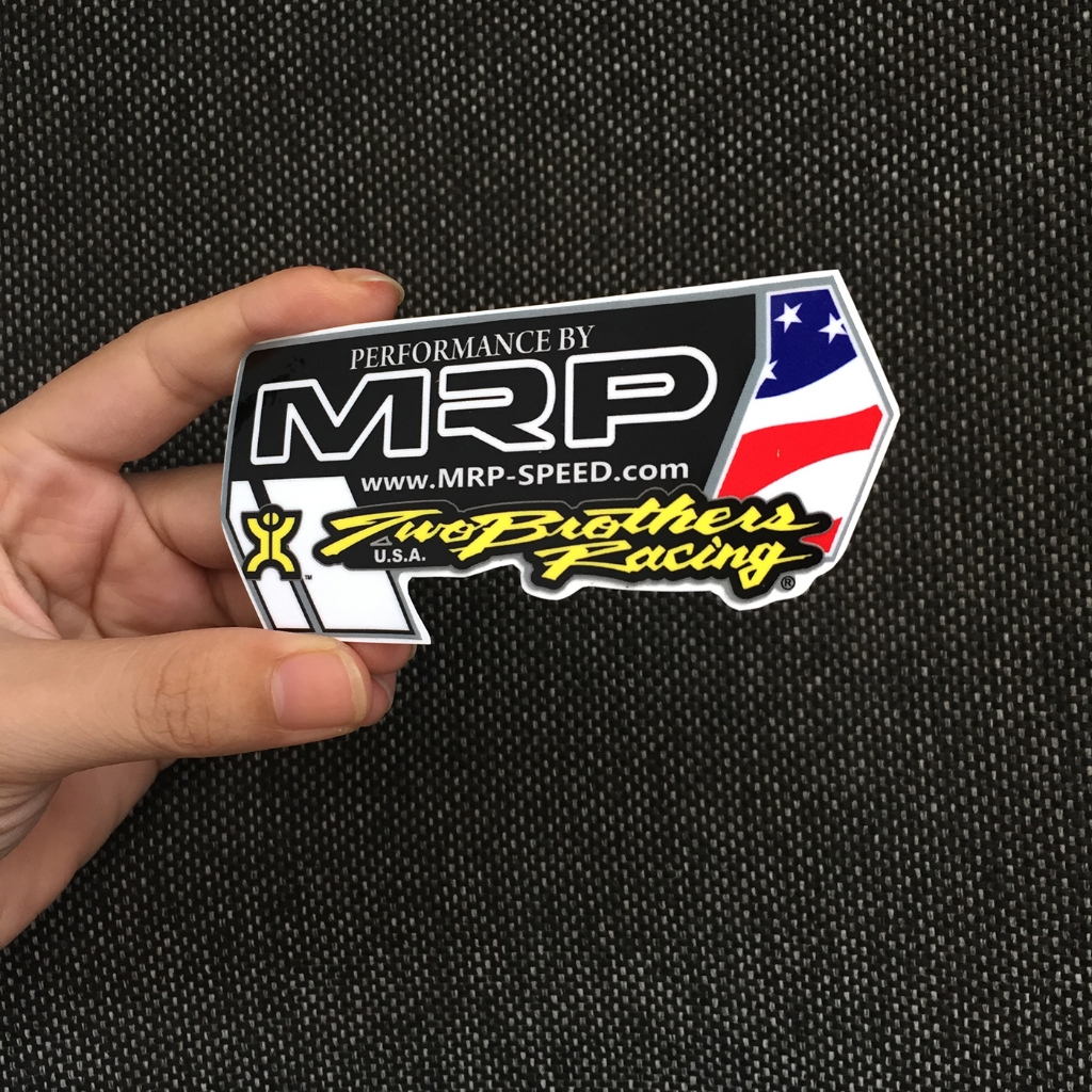 Logo TBs racing. Kích thước 10.4 x 5.8cm. Hình dán decal siêu dính. Chống nước, tem đua trang trí.