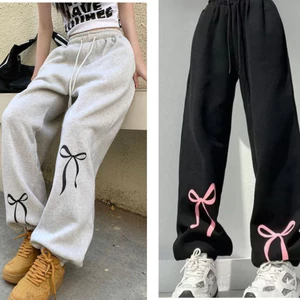 Quần bo gấu chun ống thể thao đi chơi mặc nhà Quần dài jogger in nơ đen xám cạp chun dây rút cá tính T666G