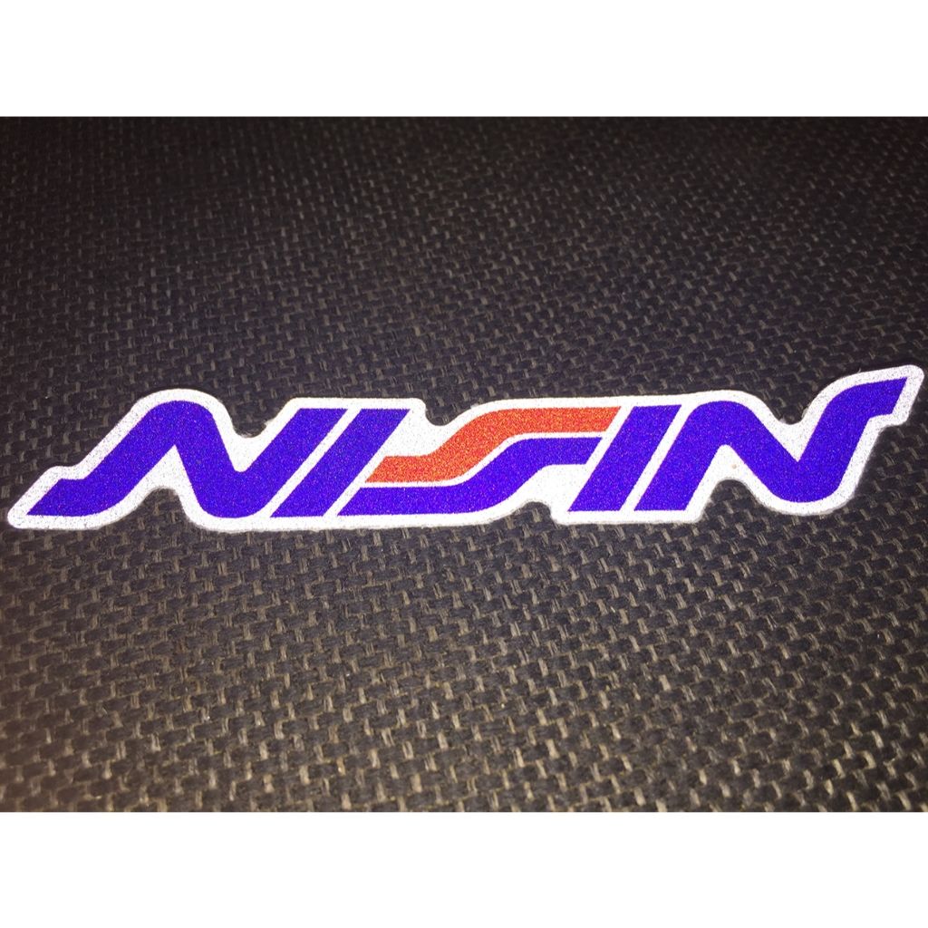 Logo NISSIN[11.2x2cm] decal phản quang 3M cao cấp chống nước. Hình dán sắc nét, bền màu, dính chặt.