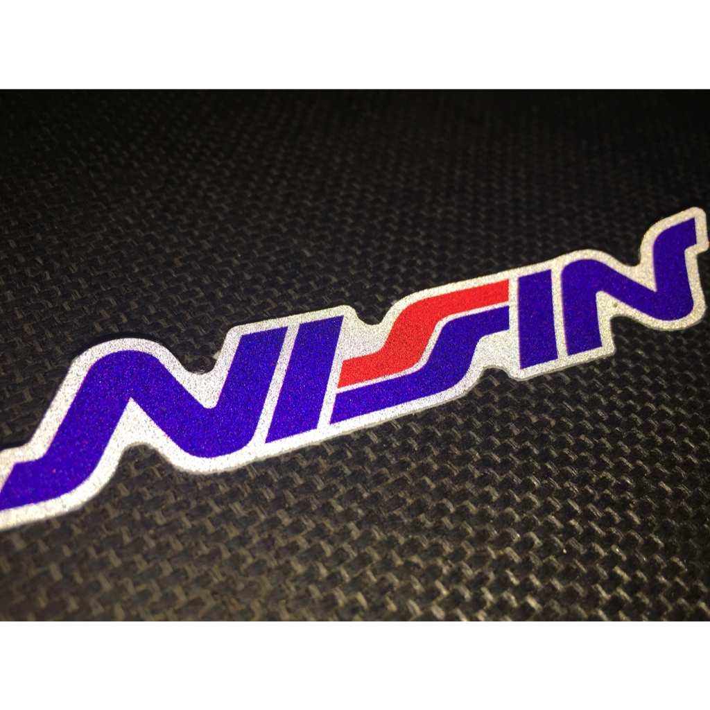 Logo NISSIN[11.2x2cm] decal phản quang 3M cao cấp chống nước. Hình dán sắc nét, bền màu, dính chặt.
