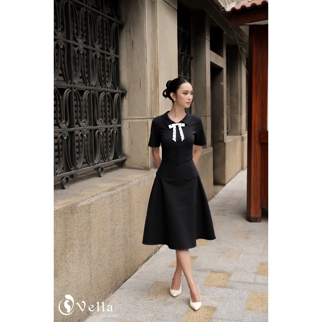 Set áo đen nơ cổ chấm bi + chân váy xòe A-line dáng dài công sở – Vella Fashion VA25062 & VV25063