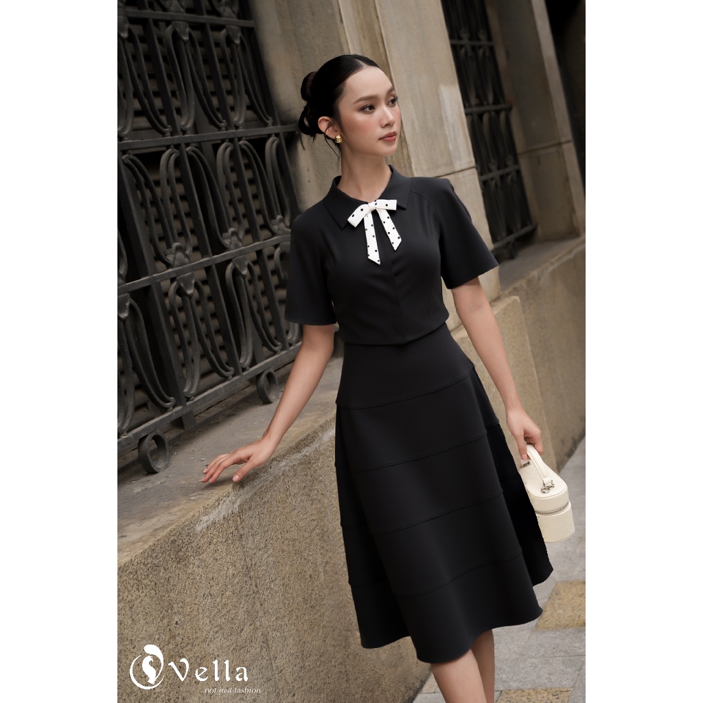 Set áo đen nơ cổ chấm bi + chân váy xòe A-line dáng dài công sở – Vella Fashion VA25062 & VV25063