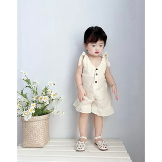 Bodysuit bé gái màu kem dáng yếm buộc nơ