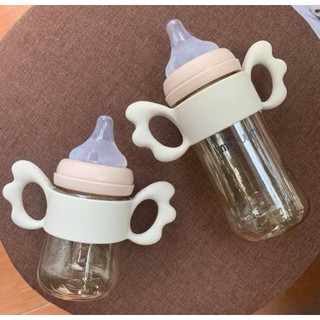 Tay cầm bình sữa silicone phù hợp với tất cả các loại bình.