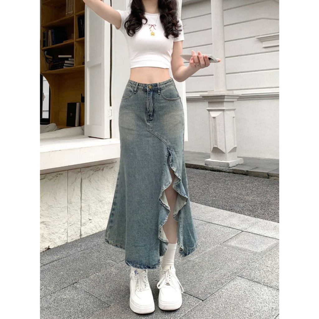 Chân váy jeans dáng dài xẻ tà lệch, viền bèo nữ tính phong cánh Hàn Quốc, co giãn, mặc được 4 mùa